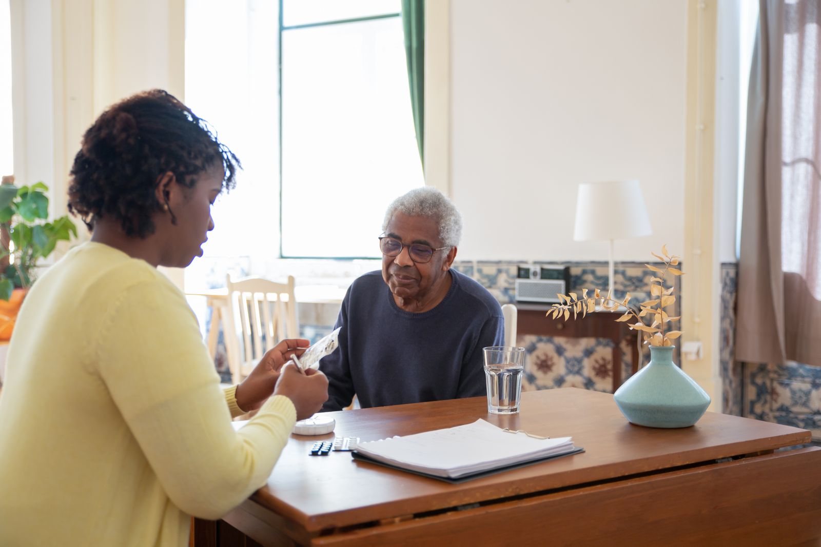 Caregiver with senior client at home
